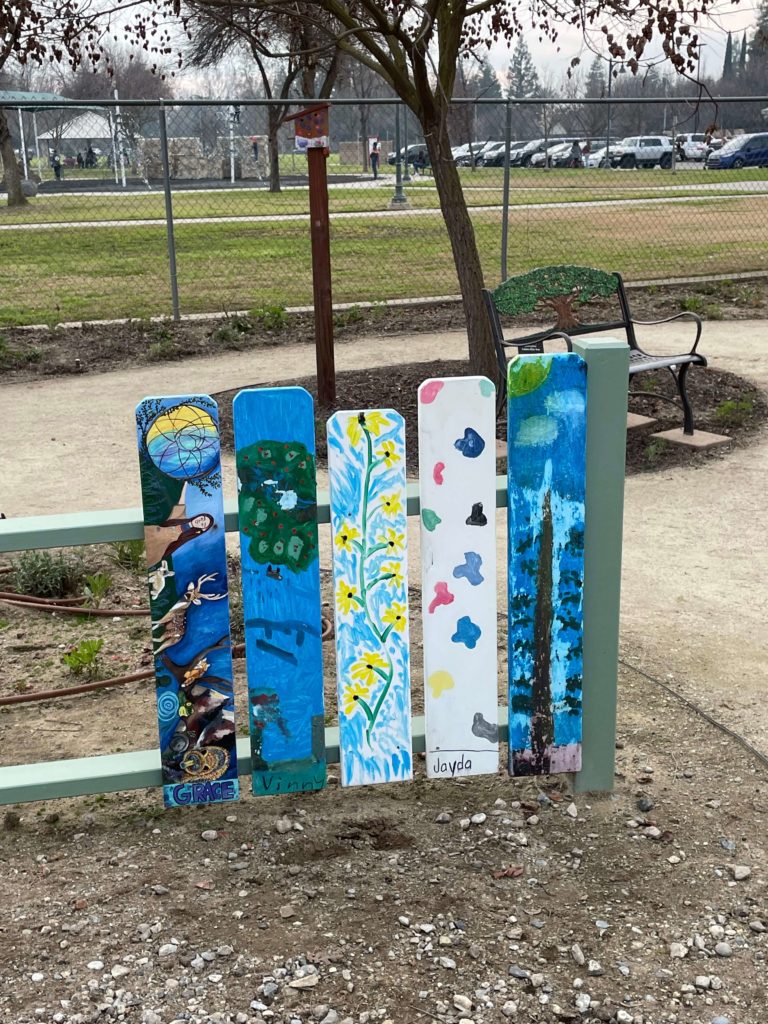 Colorful fence pickets marking the beginning of the Children's Garden