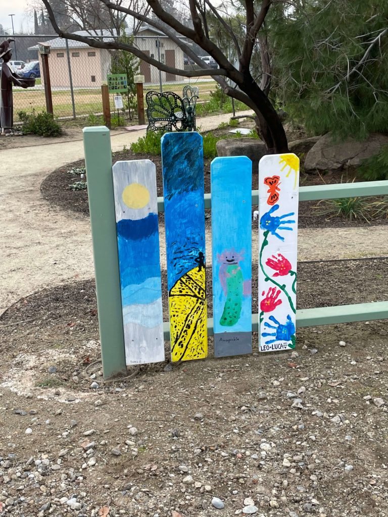Another image of the colorful fence pickets marking the beginning of the Childern's Garden